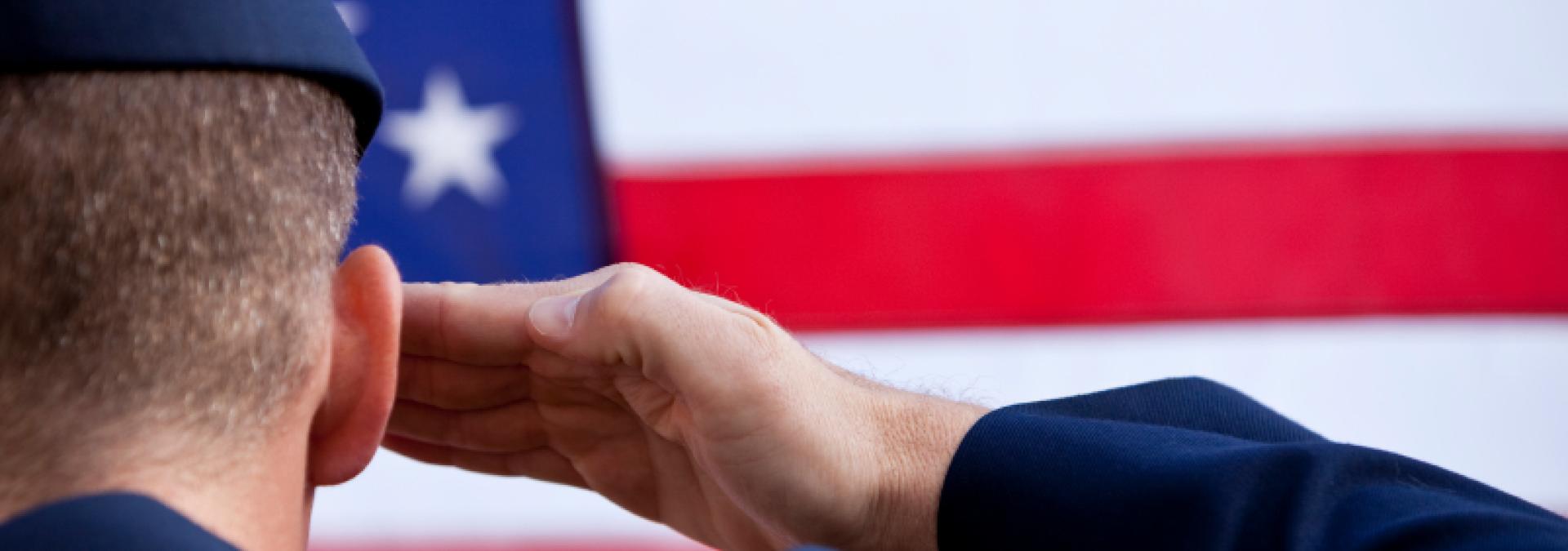 soldier saluting the US flag