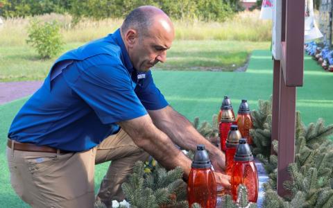 Rep. Panetta lays a candle at Saint Andrews Church in Bucha, where Ukrainian civilians murdered by Russian forces are buried.  