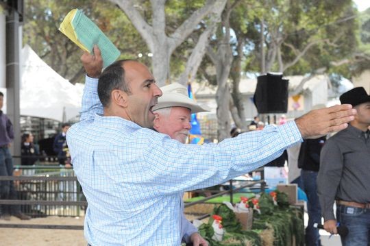 Rep. Jimmy Panetta helps with the Monterey County Fair's Junior Livestock Auction on Saturday. (Photo: Eduardo Cuevas) 